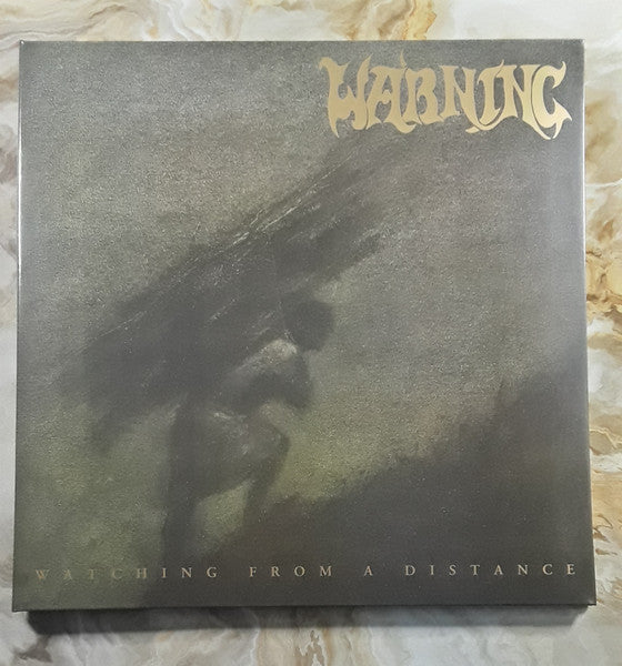 Warning – Watching From A Distance